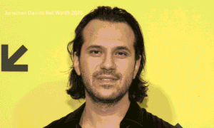 Jonathan Davino businessman and executive producer posing at a public event in a suit during 2026.